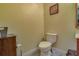 Simple bathroom with toilet and wall art at 9112 Bell Rock Pl, Land O Lakes, FL 34638