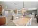 Open kitchen with light wood cabinets and a view to the living room at 11908 Whisper Creek Dr, Riverview, FL 33569