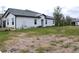 View of the backyard of a house with some dry grass at 16851 Forge Surf St, Land O Lakes, FL 34638