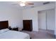 Spacious bedroom with plush carpeting, a comfortable bed, and a wooden dresser at 16851 Forge Surf St, Land O Lakes, FL 34638