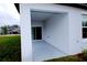 Covered patio with sliding glass doors and a view of the backyard at 16851 Forge Surf St, Land O Lakes, FL 34638