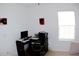 Bright home office space with a desk, computer, printer, and comfortable chair at 16851 Forge Surf St, Land O Lakes, FL 34638