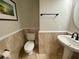 Updated bathroom with tile flooring and a pedestal sink at 3020 Sheppards Crook Ct, Holiday, FL 34691