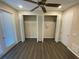 Bedroom with double closets and hardwood floors at 3020 Sheppards Crook Ct, Holiday, FL 34691