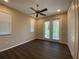 Bedroom with hardwood floors and access to a balcony at 3020 Sheppards Crook Ct, Holiday, FL 34691