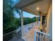 Upper deck with patio furniture and tranquil view at 3020 Sheppards Crook Ct, Holiday, FL 34691