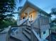 Elevated deck with stairs leading down to a pool at 3020 Sheppards Crook Ct, Holiday, FL 34691