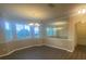 Bright dining room with hardwood floors, large windows, and elegant chandelier at 3020 Sheppards Crook Ct, Holiday, FL 34691