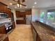 Modern kitchen with ample cabinetry and granite countertops at 3020 Sheppards Crook Ct, Holiday, FL 34691