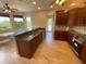 Eat-in kitchen with island, granite counters & stainless steel appliances at 3020 Sheppards Crook Ct, Holiday, FL 34691