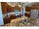 Spacious kitchen featuring granite countertops and stainless steel appliances at 3020 Sheppards Crook Ct, Holiday, FL 34691