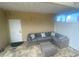 Covered outdoor lounge with comfortable seating and a patio at 3020 Sheppards Crook Ct, Holiday, FL 34691