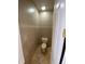 Small powder room with toilet and tile flooring at 3020 Sheppards Crook Ct, Holiday, FL 34691