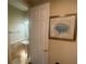 Stylish powder room with a pedestal sink and framed artwork at 3020 Sheppards Crook Ct, Holiday, FL 34691