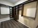 Large walk-in closet with ample shelving and hanging space at 3020 Sheppards Crook Ct, Holiday, FL 34691