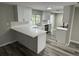 Modern white kitchen with white quartz countertops and stainless steel appliances at 3349 Overland Dr, Holiday, FL 34691