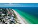 Aerial view of Indian Rocks Beach coastline with white sand and buildings at 341 Bahia Vista Dr, Indian Rocks Beach, FL 33785