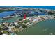 Aerial view of waterfront neighborhood with docks, boats, and beautiful water views at 341 Bahia Vista Dr, Indian Rocks Beach, FL 33785