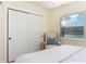 Quaint bedroom featuring a large window with a scenic waterfront view at 341 Bahia Vista Dr, Indian Rocks Beach, FL 33785
