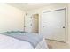 Bright bedroom with white closet doors and a comfortable bed at 341 Bahia Vista Dr, Indian Rocks Beach, FL 33785