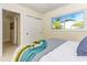 Comfortable bedroom with ceiling fan, sliding closet doors, and large window at 341 Bahia Vista Dr, Indian Rocks Beach, FL 33785