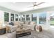 Coastal-style living room with large windows overlooking the water at 341 Bahia Vista Dr, Indian Rocks Beach, FL 33785