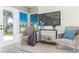 Living room sitting area with comfortable chairs and a view of the water at 341 Bahia Vista Dr, Indian Rocks Beach, FL 33785
