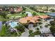 Stunning aerial view of the community clubhouse, pool, and lush green landscaping at 4327 Murfield E Dr, Bradenton, FL 34203