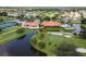 Aerial view showcasing the community's clubhouse, golf course, and scenic ponds at 4327 Murfield E Dr, Bradenton, FL 34203
