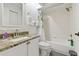 Clean white bathroom featuring a shower-tub combo and granite countertop sink at 4327 Murfield E Dr, Bradenton, FL 34203
