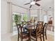 Dining space with a wood table, seating for six, and sliding doors that provide natural light at 4327 Murfield E Dr, Bradenton, FL 34203
