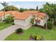 Well-manicured front yard with a single-story home and a two-car garage at 4327 Murfield E Dr, Bradenton, FL 34203