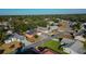 Aerial view of a residential neighborhood with houses and trees at 4401 Plumosa St, Spring Hill, FL 34607