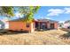 Backyard with screened-in patio, landscaping, and raised garden beds at 4401 Plumosa St, Spring Hill, FL 34607