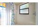 Simple bathroom with tile shower and a decorative shower curtain at 4401 Plumosa St, Spring Hill, FL 34607