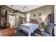 Cozy bedroom with striped bedding, wood furniture, and plush chair at 4401 Plumosa St, Spring Hill, FL 34607