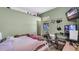 Bedroom with a bed, desk, and wall-mounted TV at 4401 Plumosa St, Spring Hill, FL 34607