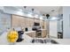 Bright kitchen with stainless steel appliances, white countertops, and light wood cabinets at 4401 Plumosa St, Spring Hill, FL 34607