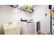 Laundry room equipped with a washer, dryer, and utility sink at 4401 Plumosa St, Spring Hill, FL 34607