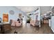 Living room with wood-look flooring, vaulted ceilings, and an open floor plan at 4401 Plumosa St, Spring Hill, FL 34607