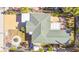 Aerial view showing home's layout, roof, and surrounding landscape at 504 79Th Ave, St Pete Beach, FL 33706
