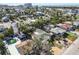 High-angle view of a neighborhood with a pool and lush vegetation at 504 79Th Ave, St Pete Beach, FL 33706