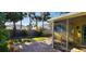 Backyard with a patio, landscaping, a wooden fence, and palm trees at 504 79Th Ave, St Pete Beach, FL 33706