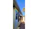 Exterior view of the home's side, with door, window, awning, and walkway at 504 79Th Ave, St Pete Beach, FL 33706