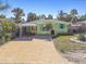 Charming yellow house with a brick driveway at 504 79Th Ave, St Pete Beach, FL 33706