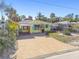 Charming beach house with paver driveway and tropical landscaping at 504 79Th Ave, St Pete Beach, FL 33706
