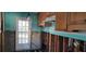 Renovation in progress, showcasing kitchen's layout and back door at 504 79Th Ave, St Pete Beach, FL 33706