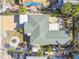 Top-down view of a house with a green roof, surrounded by landscaping and neighboring properties at 504 79Th Ave, St Pete Beach, FL 33706
