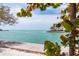 Tranquil waterfront view with lush foliage at 504 79Th Ave, St Pete Beach, FL 33706