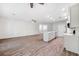 Large living space features a modern kitchen with island seating, ideal for entertaining guests and Gathering at 6454 Freeport Dr, Spring Hill, FL 34608
